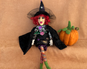 Velora sitting with a pumpkin (sold separately) 